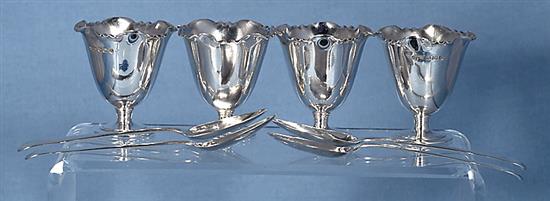 A Victorian silver egg cruet set with four egg cups,